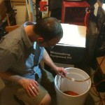siphoning fermented wort into dissolved priming sugar